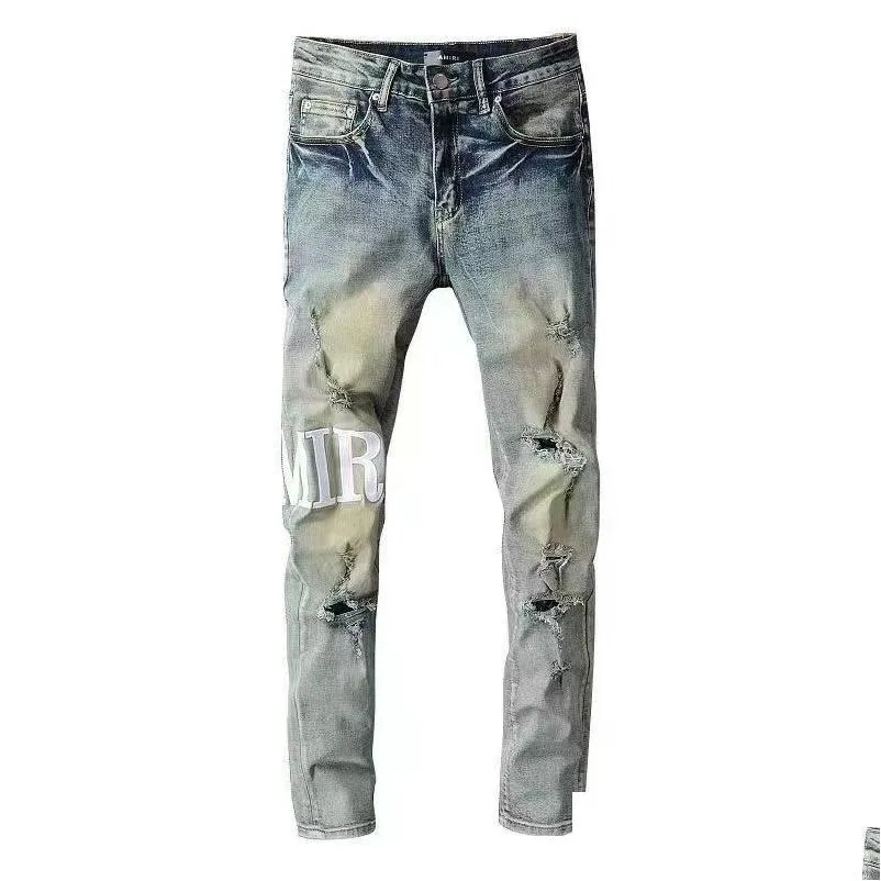 Męskie dżinsy 23SS Designer dżinsowe litery Błękitne dziury High Street Es Slim Spodni noszone na zewnątrz Ubranie odzieży DHNS4