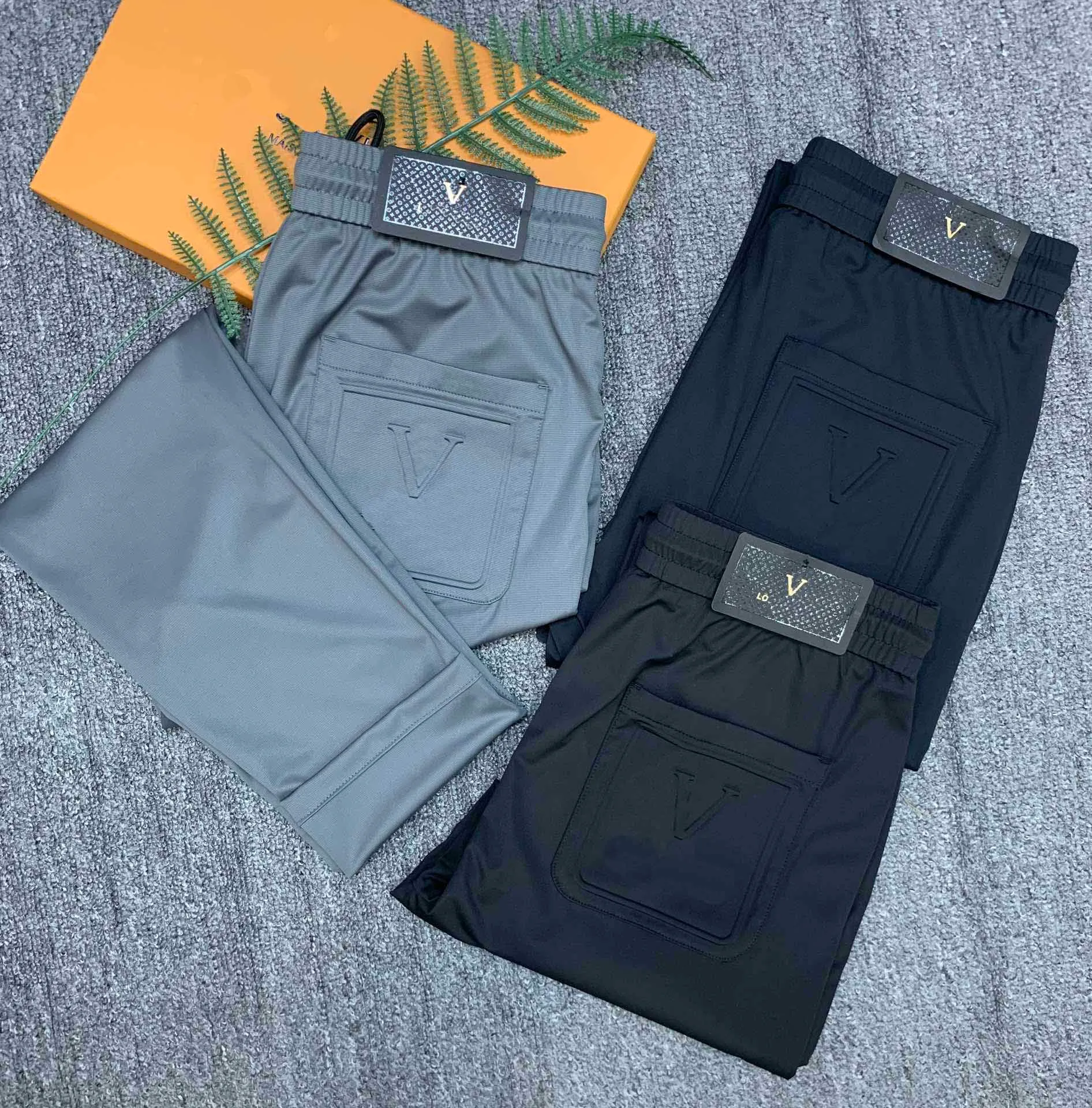 Lll 2024 Spring/Summer Designer Luxury Men's Dress Pants Business Pants Casual Pants Fashion Märke Solid Färg Fyra-sidigt Stretch Sticked Fabric Wholesale