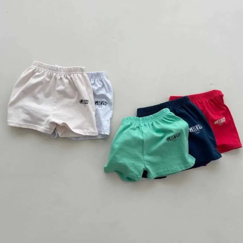 Shorts 2024 Summer New Baby Loose Shorts Baby Boys and Girls Letter Printed Casual Shorts Cotton Preschool Fashion Edition Sports Shorts d240510