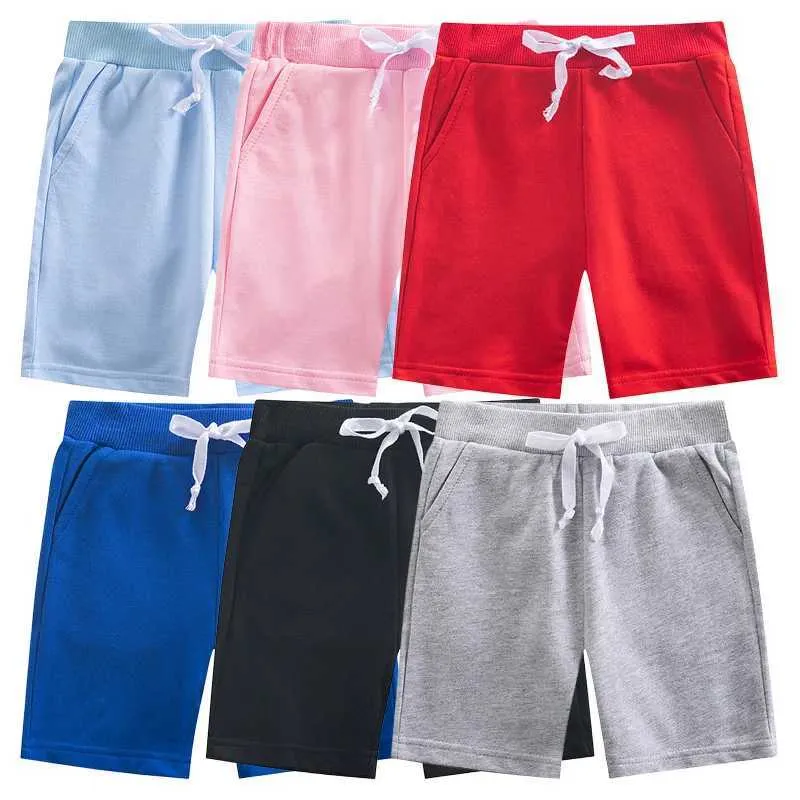 Shorts 2024 Summer Boys and Girls Shorts Solid Color Childrens Elastic Midje Beach Shorts Sport Pants Preschool Clothing D240510