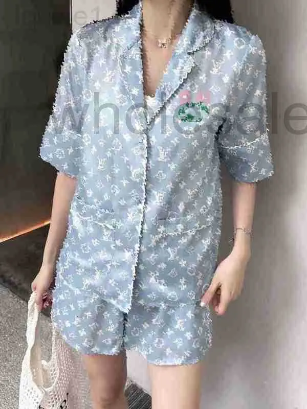 Dwuczęściowe spodnie designerskie marka marki piżamy w stylu piżamowym nadrukowana koszula z krótkim rękawem z elastycznym opaską szorty tylne kwiatowe ozdoby tk5q 4yos
