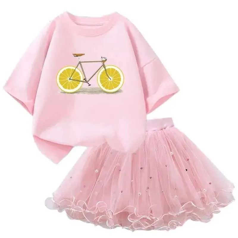 Kläder set flickor 2-stycken tutu skid set frukt citron/jordgubb kort ärm t-shirt+pettiskirt set sommar födelsedagsfest klänning setl2405