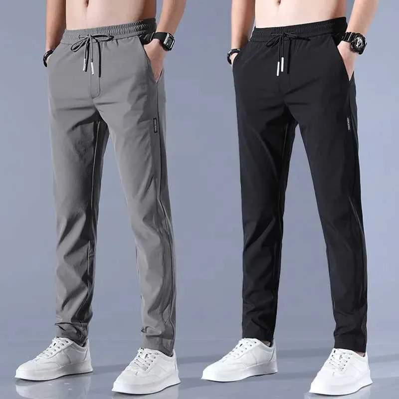 Herrenhosen 2024 Eis Silk Herren Sommer Neues schwarzes graues dünne Business Casual Hosen Outdoor Elastizität atmungsaktives Bein Sporthosen Y240513