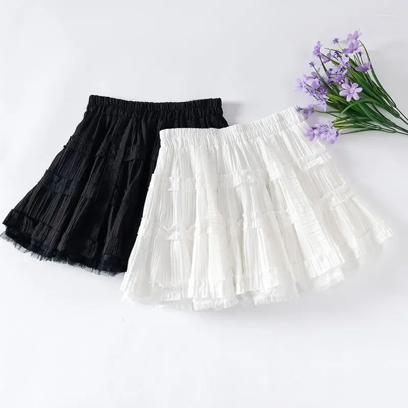 Jupes élastique taille blanche noire lolita plissée volant mini femmes occasionnelles jupe courte couture coréenne douce fille couche