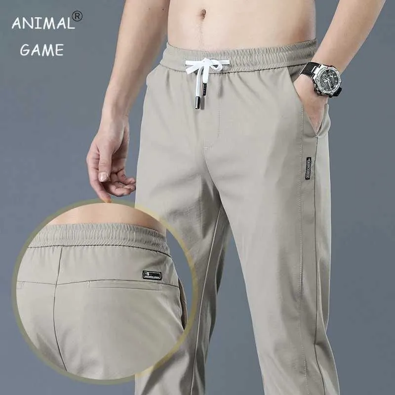 Pantalones para hombres Nuevos pantalones casuales para hombres primavera de primavera pantalones delgados delgados pantalones de moda macho estiramiento caqui jogging 28-38 y240513