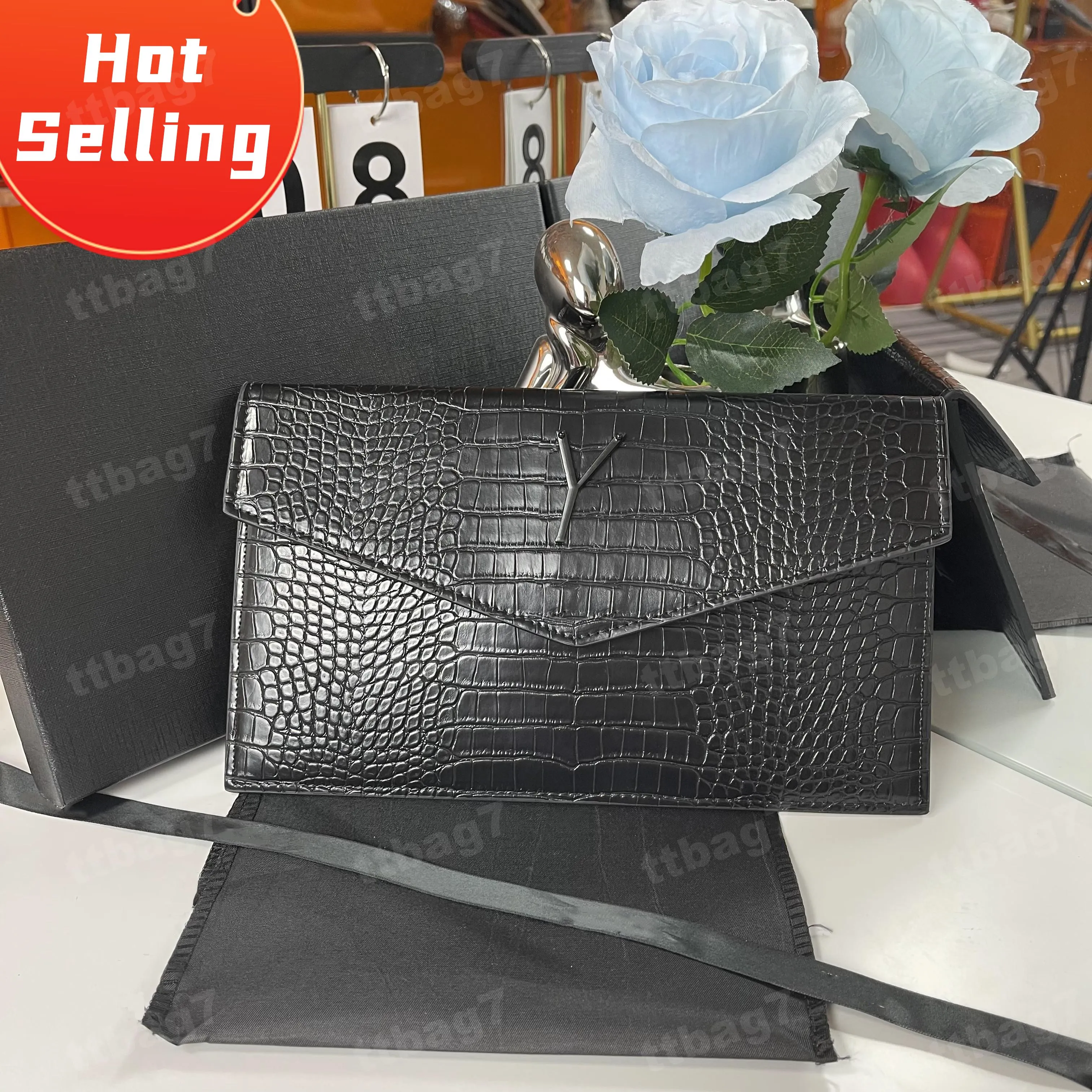 Clutch bag brand name on sale