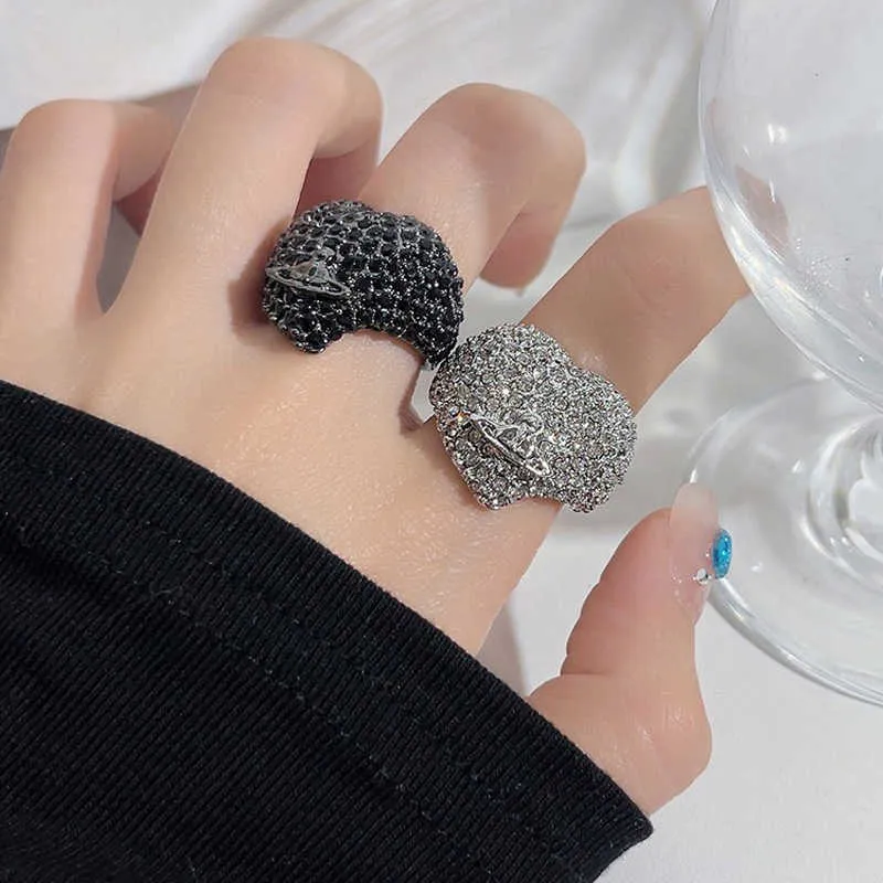 Designer Westwoods weiwei uma personalidade leve de luxo diamante completo amor tridimensional saturn anel na moda em forma de coração indicador dedo unha