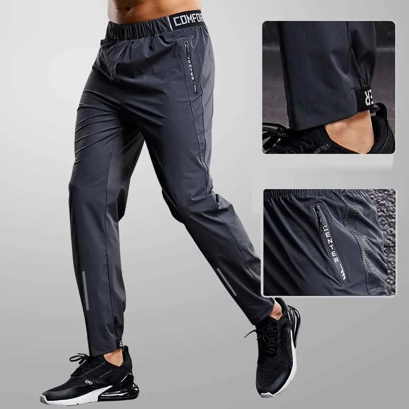 Spodnie męskie Szybkie suszenie Spodnie Spodnie Mężczyźni biegnący spodnie z kieszeniem na zamek błyskawiczne trening joggings sporty spodni fitness swobodny dres y240513