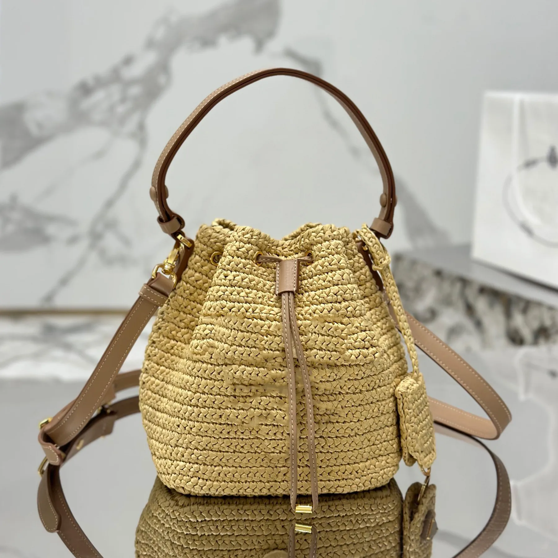 Último ganchillo de verano y mini bolso de cuero Diseñador de lujo Weave de paja Mango de cuero ajustable Bolso de hombro Bolso de mano de llave extraíble