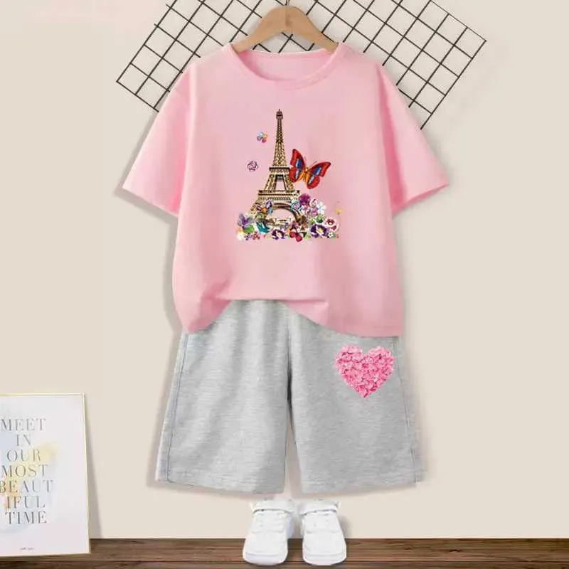 Kläduppsättningar Summer Girls Set Butterfly Eiffel Tower Tryckt kortärmad T-shirt+Shorts 2-stycke Set av barns modeparty Kläder2405L2405