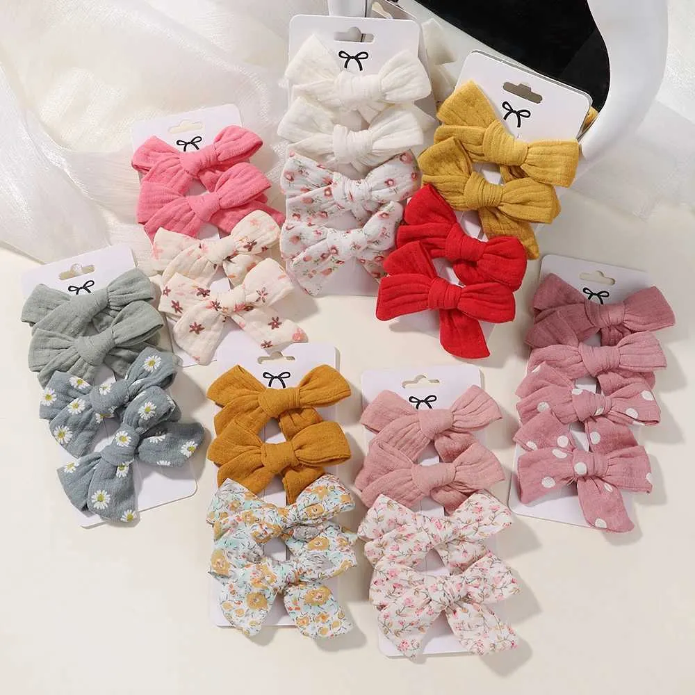 ヘアアクセサリー4pcs/set girls bows bows hair clips cottont linen barrette flower print hairclip新生児ヘアアクセサリーセットセット