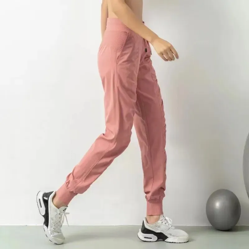 Женская йога йога брюки брюки свободные спортивные штаны Lady Fitness Sports Joggers, проводя эластичные брюки для похудения.