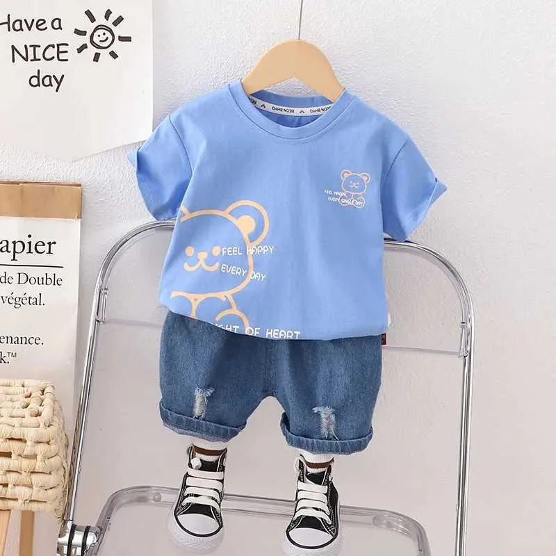 Set di abbigliamento Nuovi bambini in cotone estate in cotone per bambini Shorts orso cartone animato Shorts 2 pezzi/set di tracking in materia di moda per la moda per la moda set casual baby casual set d240514