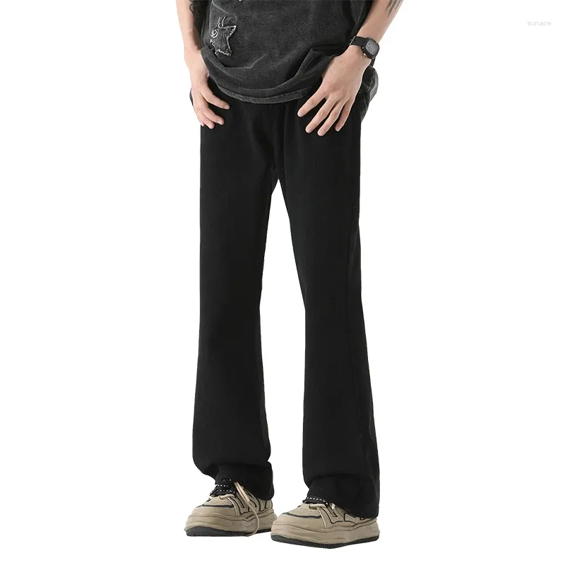 Jeans pour hommes printemps automne de couleur solide bouton zipper à la taille haute