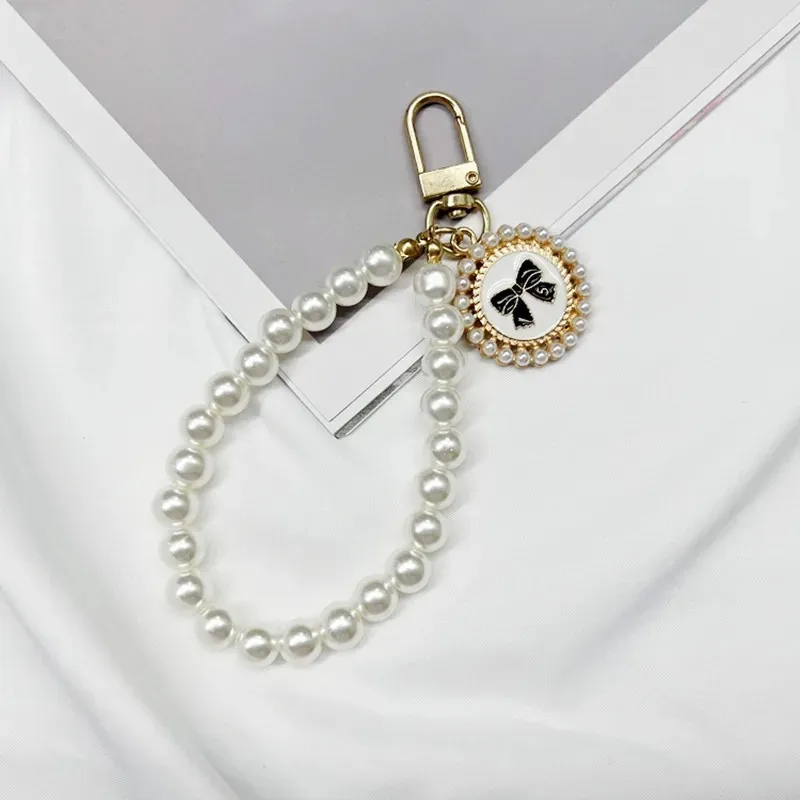 Krótki Pearl smycz mody wisiorek wisiorek w zawieszek w zawieszek telefon komórkowy ręcznie tkany pasek na nadgarstek
