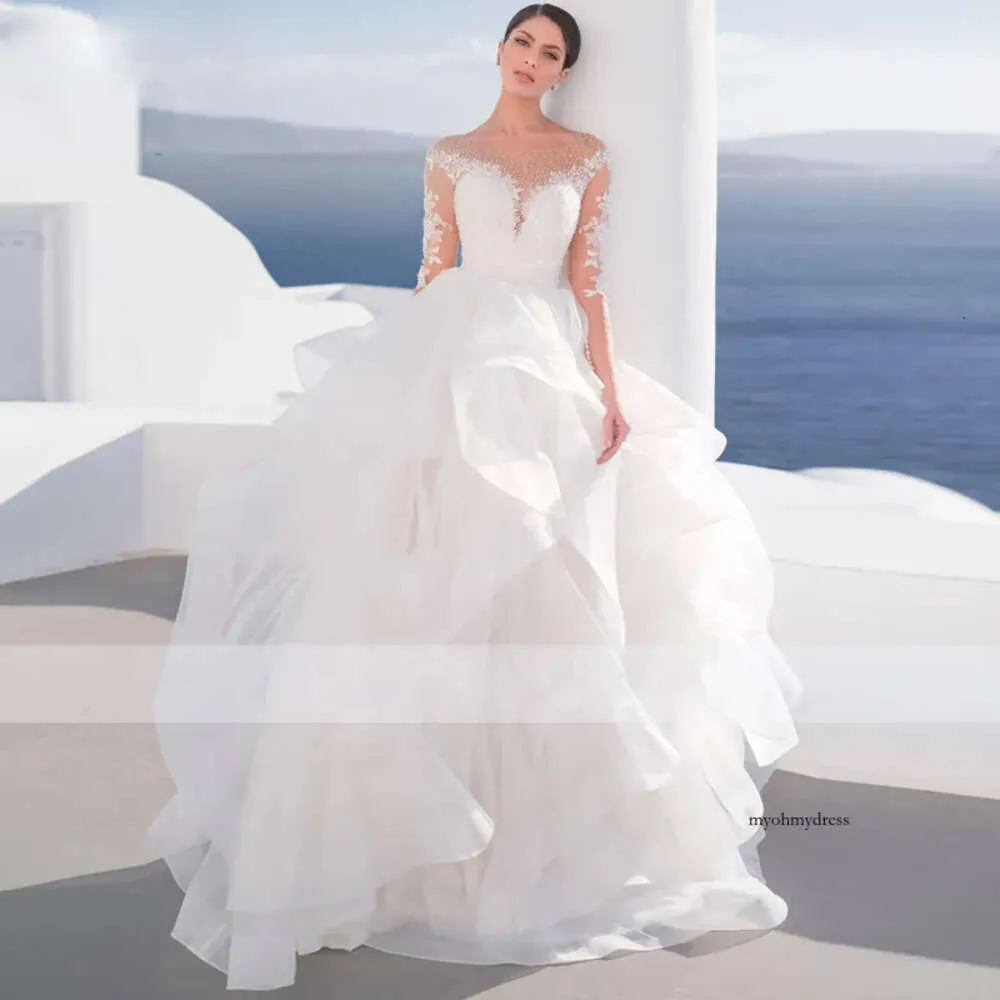 Beautiful Ruffles Ball Dresses Illusion Scoop Neck Beach Bridal Cascading Tiere Wedding Gown with Long Sleeve 0516
