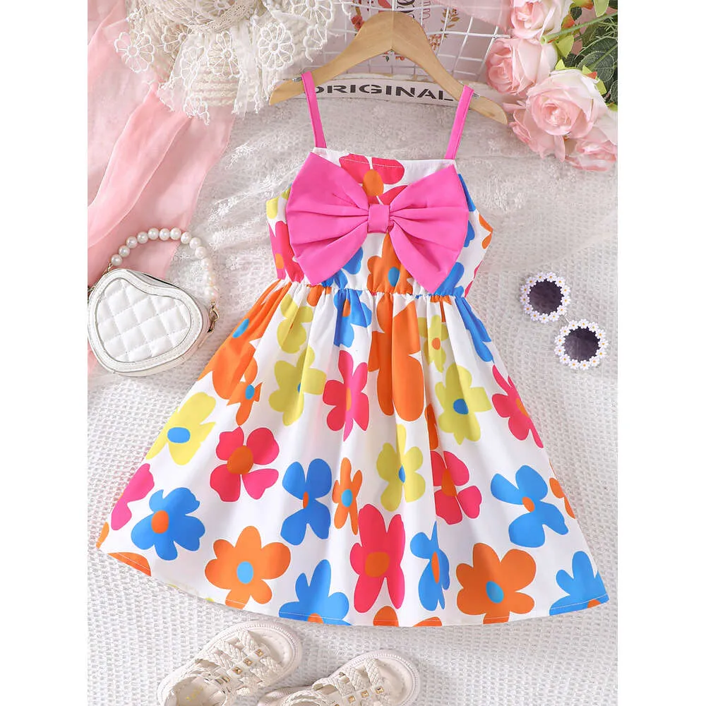 Girls Summer New Sweet mignon Flower Sling pour les vacances de loisirs, petit et frais, robe de design à gros arc l2405