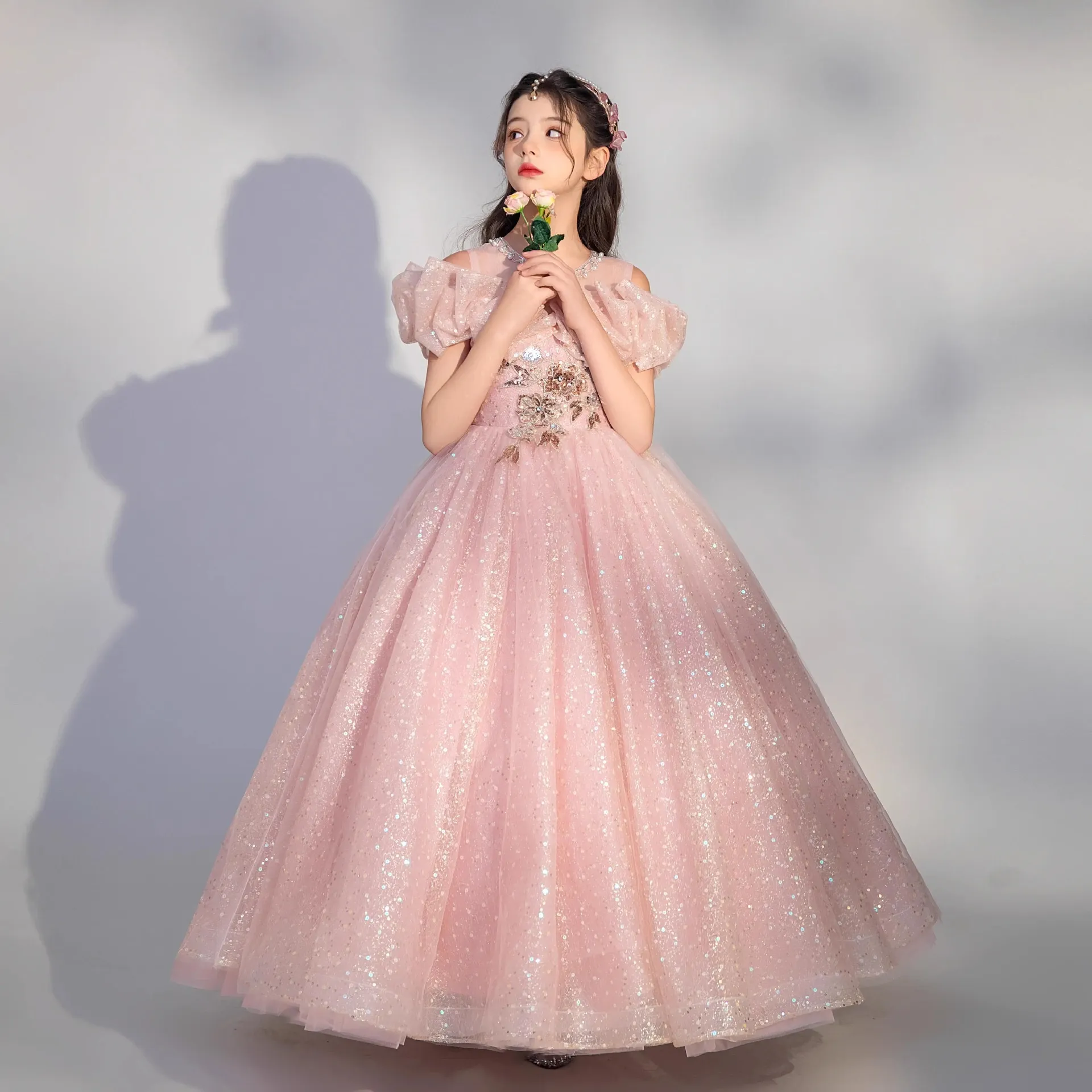 Elegant pink sequined ball gown for formal occasions