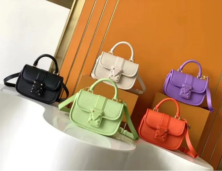 Female purse designers on sale