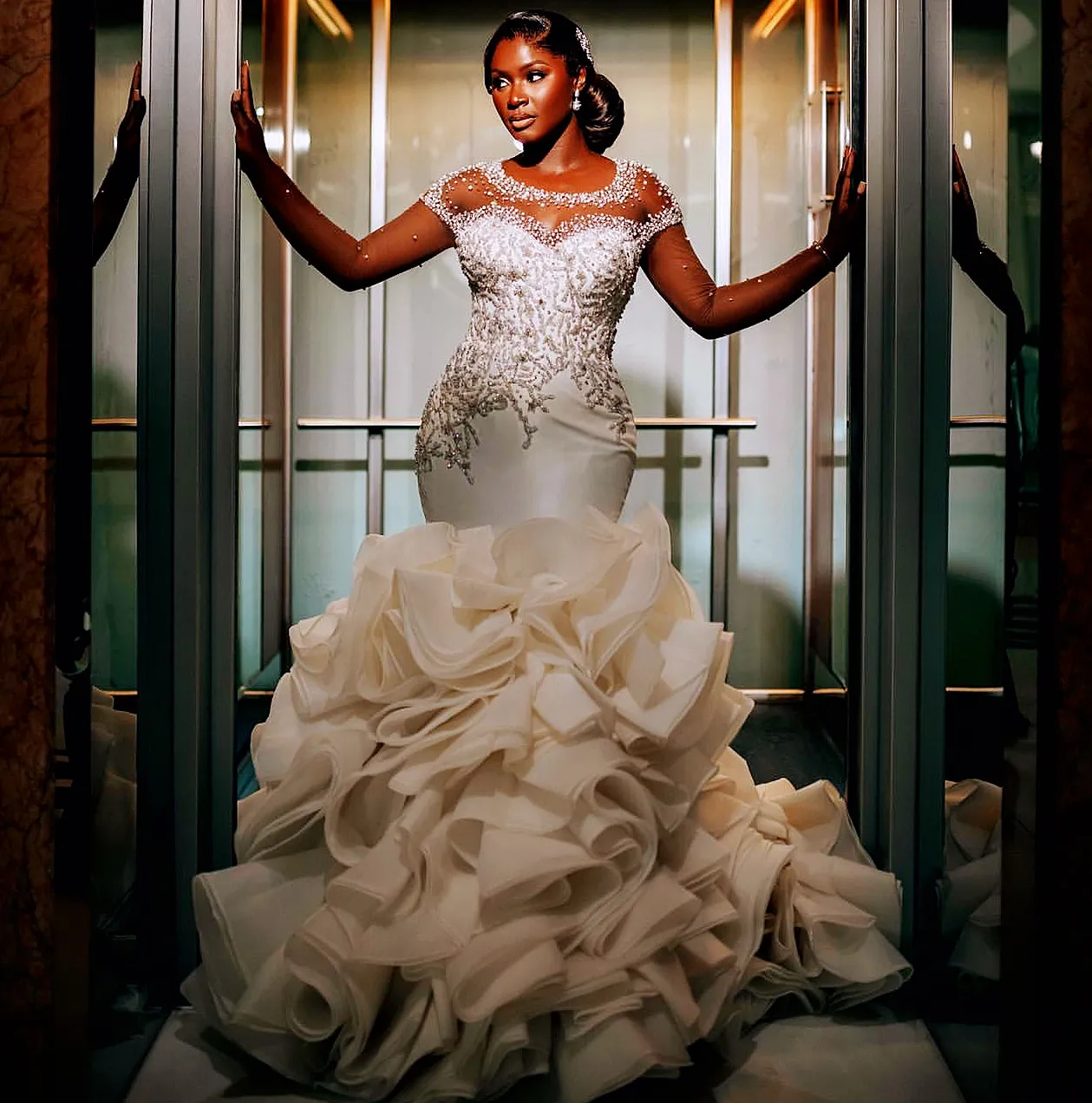 Ivory mermaid wedding dress with Beaded Crystals and Satin Tiers - Aso Ebi 2024 Collection Ivory mermaid wedding dress with Beaded Crystals and Satin Tiers - Aso Ebi 2024 Collection