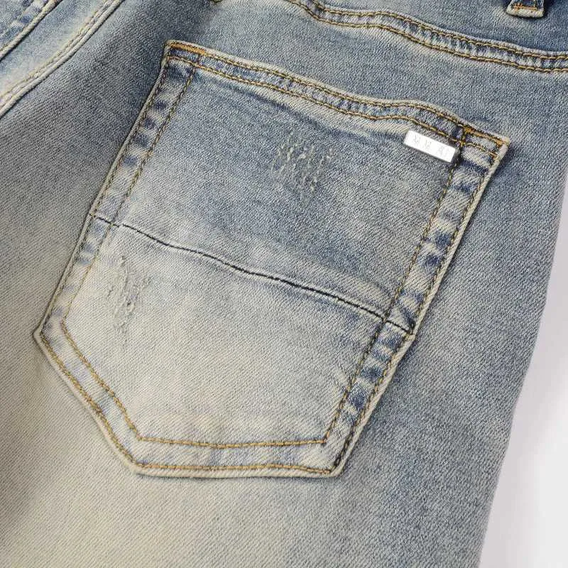 Jeans slim fit da uomo con strappi e patchwork bandana blu_voghion.com