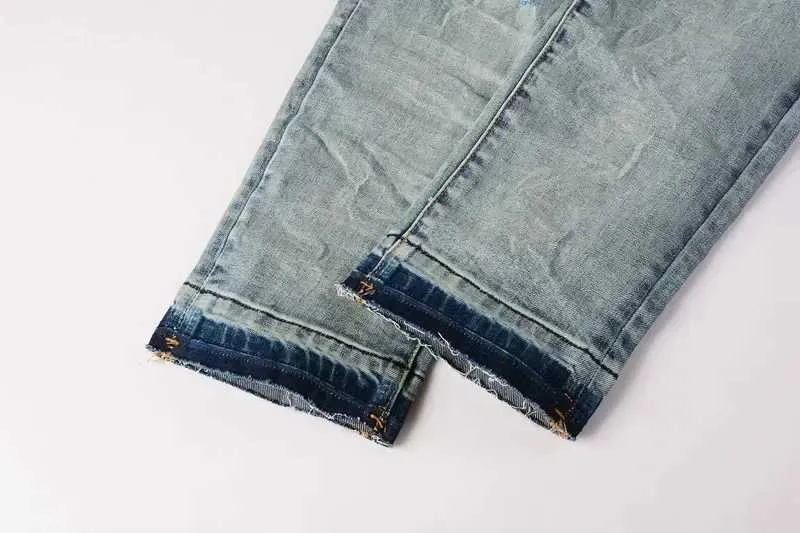 Jeans skinny viola da uomo con strappi e patch effetto usato_voghion.com