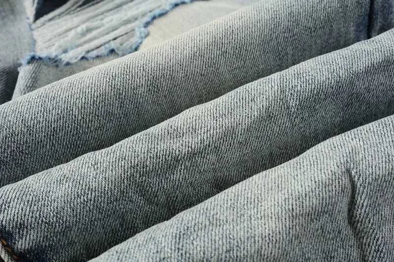 Jeans skinny viola da uomo con strappi e patch effetto usato_voghion.com