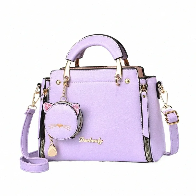 DHgate Womens Versatile Genuine Leather Shoulder Bag with Cat Ornament Trendy Handbag for All Occasions Bags Luggage Accessories