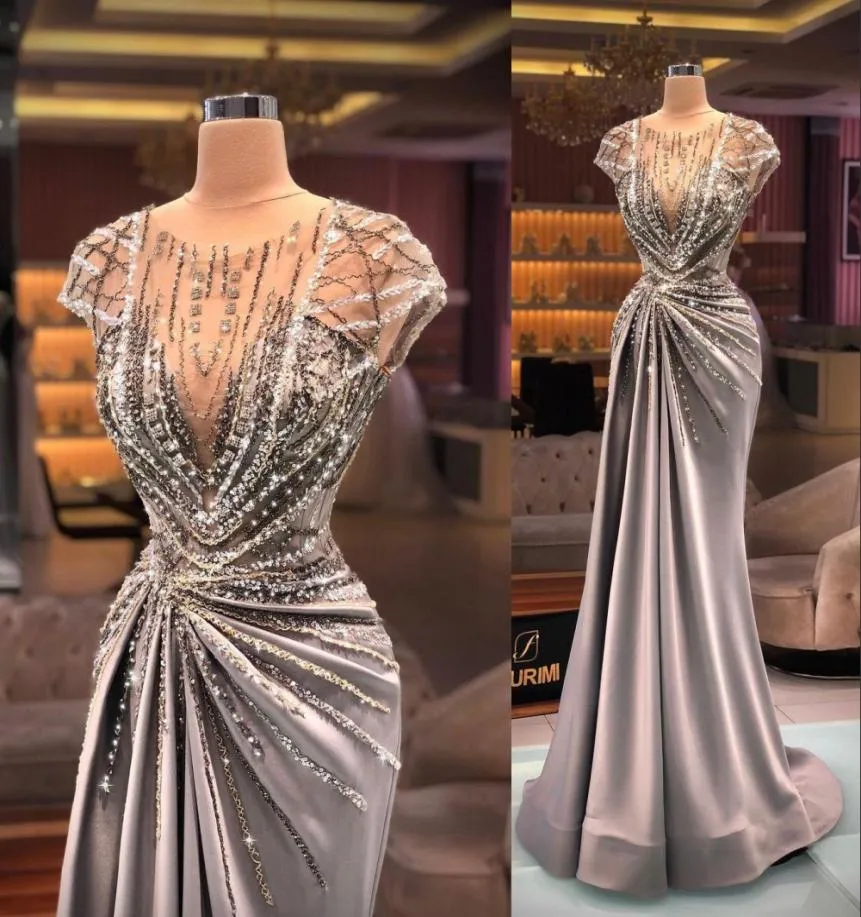 2021 Arabic Sexy Luxury Prom Dresses Jewel Neck Illusion Cap Sleeves Crystal Beading Sequins Bling Formal Party Dress Evening Gown1810646