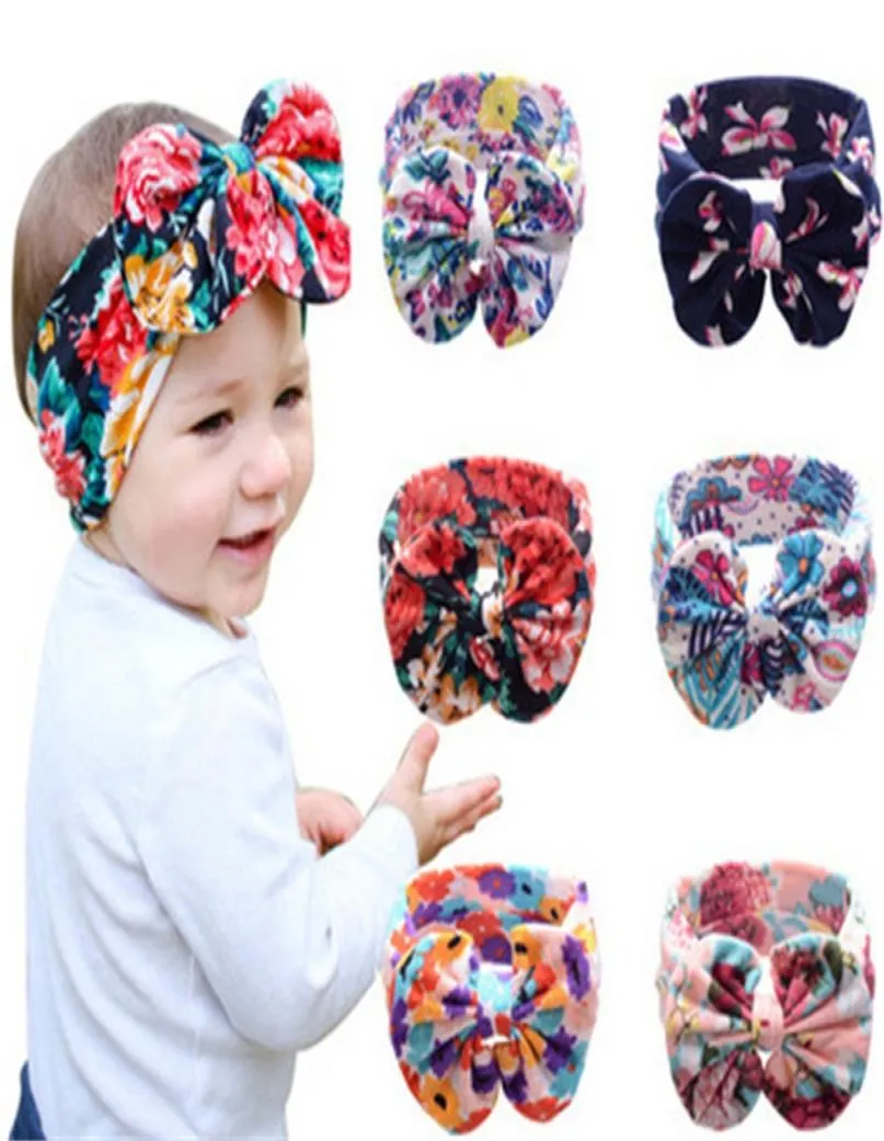 Nya 6Colors Baby Girls Stretch Multicolor Printing Big Bow pannband Spädbarn Blomma Hårband Söta barn Hårtillbehör C12782559954