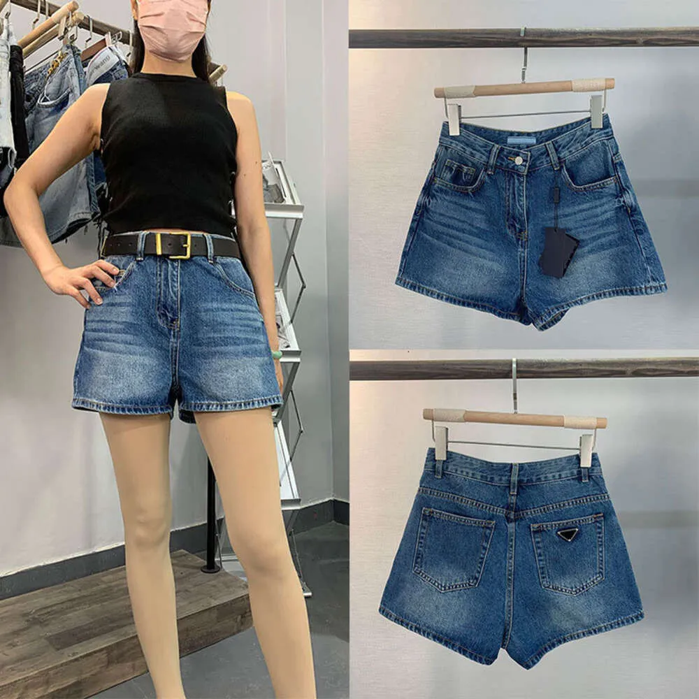 Rak 2023 sommar ny triangeletikett denim shorts kvinnor hög midja bantning mångsidig lös bred benbyxor