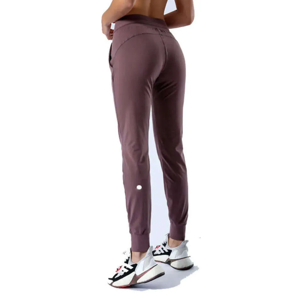 2024 Lululemeni Women Yoga Pants التاسع دفع طماق Fiess Soft High Hip Lift مرونة الركض غير الرسمي تجريب السراويل أزياء KGU668