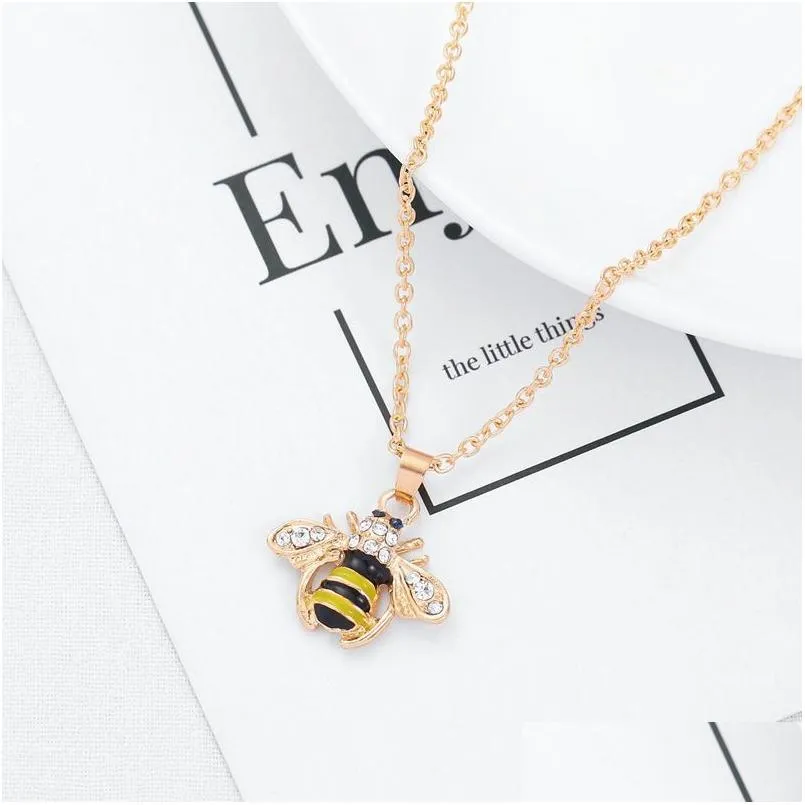 Colliers pendentiels Collier d'abeille insecte champagne zircon gold couleur bijoux fiançailles engagement couvre gouttes livraison bijoux pendentifs dheys