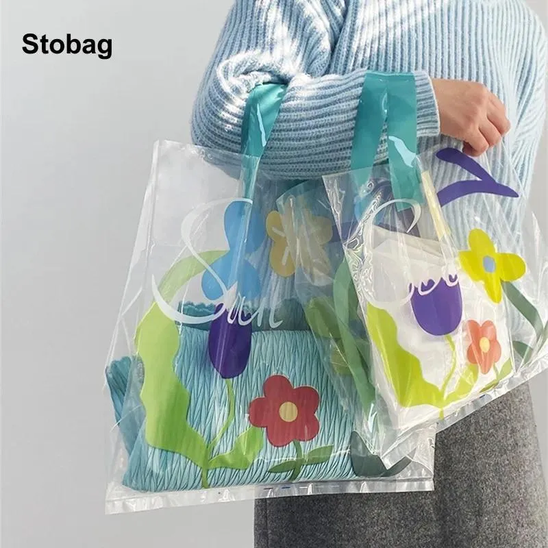 Сумки для хранения Stobag 50pcs прозрачная торговая сумка пластиковая цветочная одежда для одежды для упаковки пакета портативный на заказ логотип (дополнительная плата)