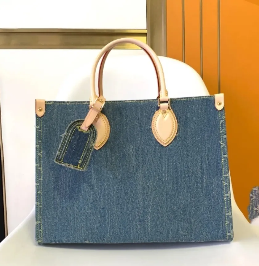 Sac fourre-tout bleu en jean transportant mm Sac à épaule moyen sac à main