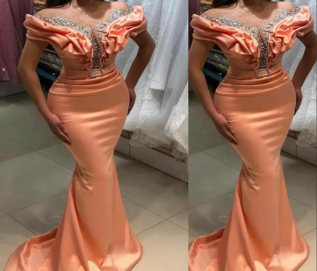 2022 Sexy Arabic Peach Mermaid Prom Dresses Jewel Neck Illusion Cap Sleeves Silver Beaded Crystal Party Dresses Evening Gowns Swee7196821