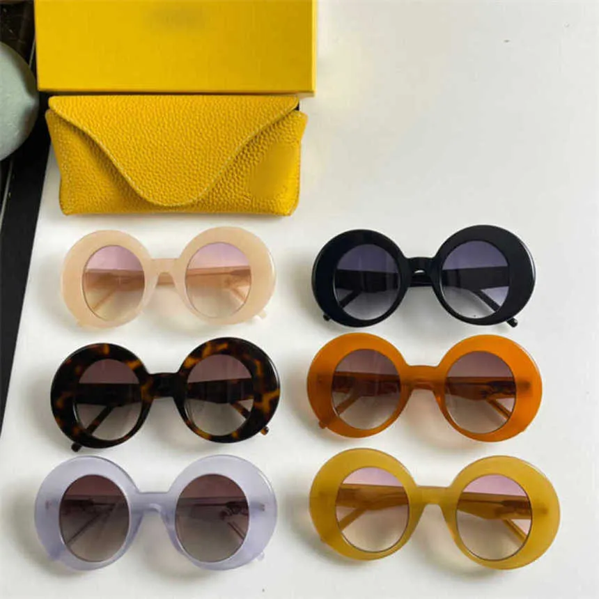 2024 New High Quality luxury designer New Luo Yijia sunglasses round frame mesh red INS the same style personalized and fashionable Sunglasses LW40089