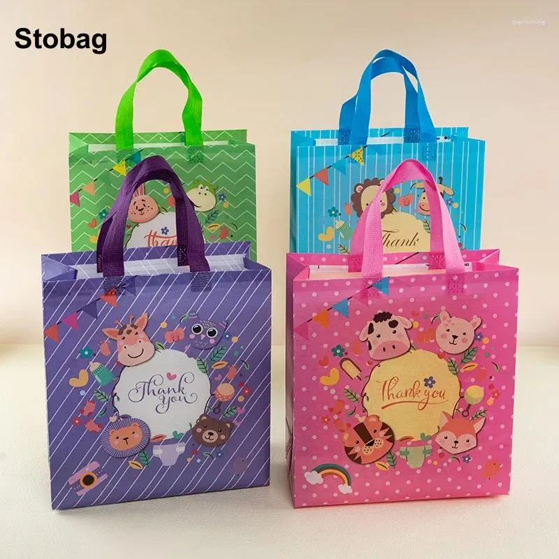 Sacs de rangement Stobag 12pcs Paquet cadeau Tot Fabric non tissé merci pour les enfants anniversaire étanche à la poche réutilisable Favors