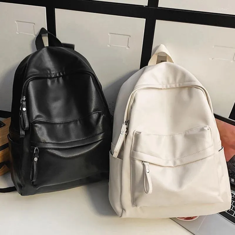 Mochila de grande capacidade PU Mulheres homens viajam de bagpack sacos escolares de alta qualidade para meninas Bola de livro mochilas casal