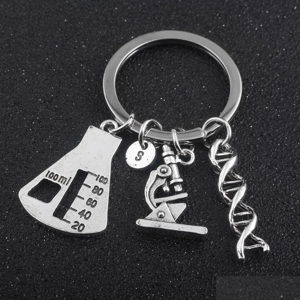 Keychains Lanyards SG Nyaste biologiska experimentella verktygsnyckelkedjor Koniska kolv Molecar DNA Microscope Pendant Keychain Drop Del DHBMD