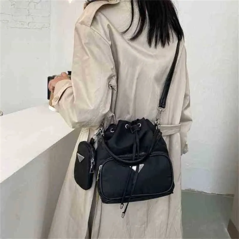 2024 New Designer womens crossbody shoulder trend and back nylon cloth backpack with bucket fashionable personality simple small bag