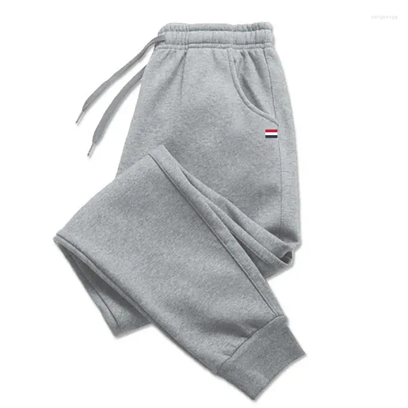 Pantaloni maschili 2024 marchio autunno inverno uomini/donne che allenano pantaloni della tuta che fa jogging con pellicola casual confortevole percorsa da streetwear