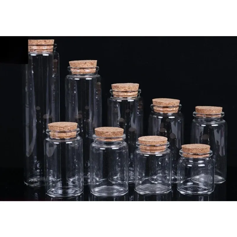 Bouteilles de rangement bouteilles en verre avec des pots d'épices de couvercles de liège souhaitant des bouteilles en verre pots en verre