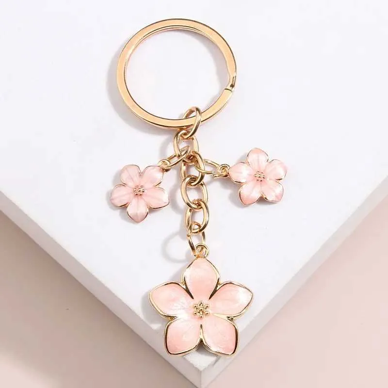 Keychains Lanyards söta växt Keychain Sakura Flower Key Ring Emamel Chains For Women Girls Handbag Accessorie Car Keys Diy Sweet Jewelry Gifts Q240403