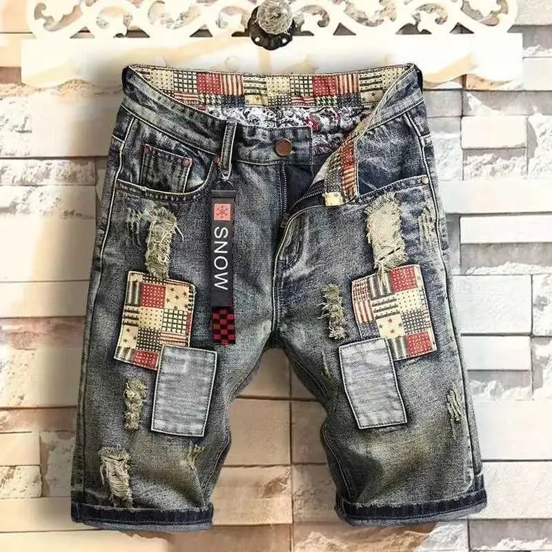 Heren shorts Heren Retro -stijl gescheurde denim shorts 2024 zomer nieuwe mode casual gat patch jeans shorts shorts heren merk kleding J240407