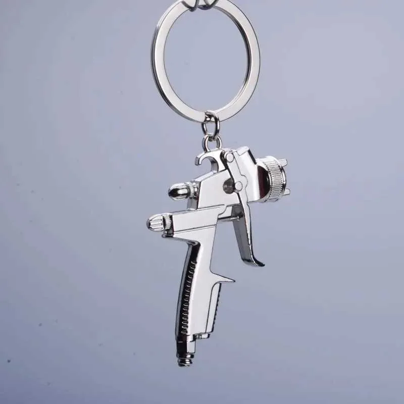 Keychains colhedas metal novo pistol de água Ferramentas de lavagem de carros de alta pressão Modelo de pistola de água Chave Party Pingente Pingente Key Ring K2011 Q240403