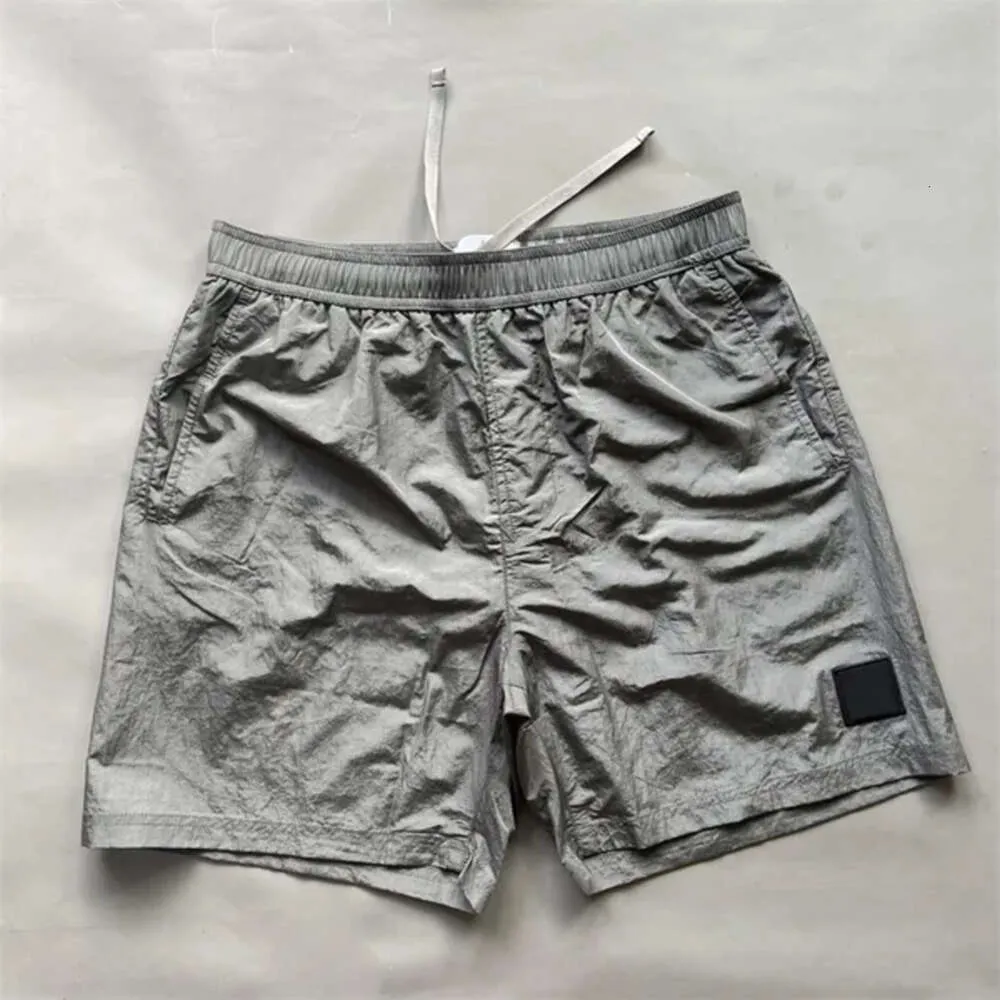 2024 Top Stone Shorts Compass Diseñador de bordado para hombres Metal Nylon Shashs Fashion Hight Street Sports Shorts de secado rápido Man Pantalones de playa 244