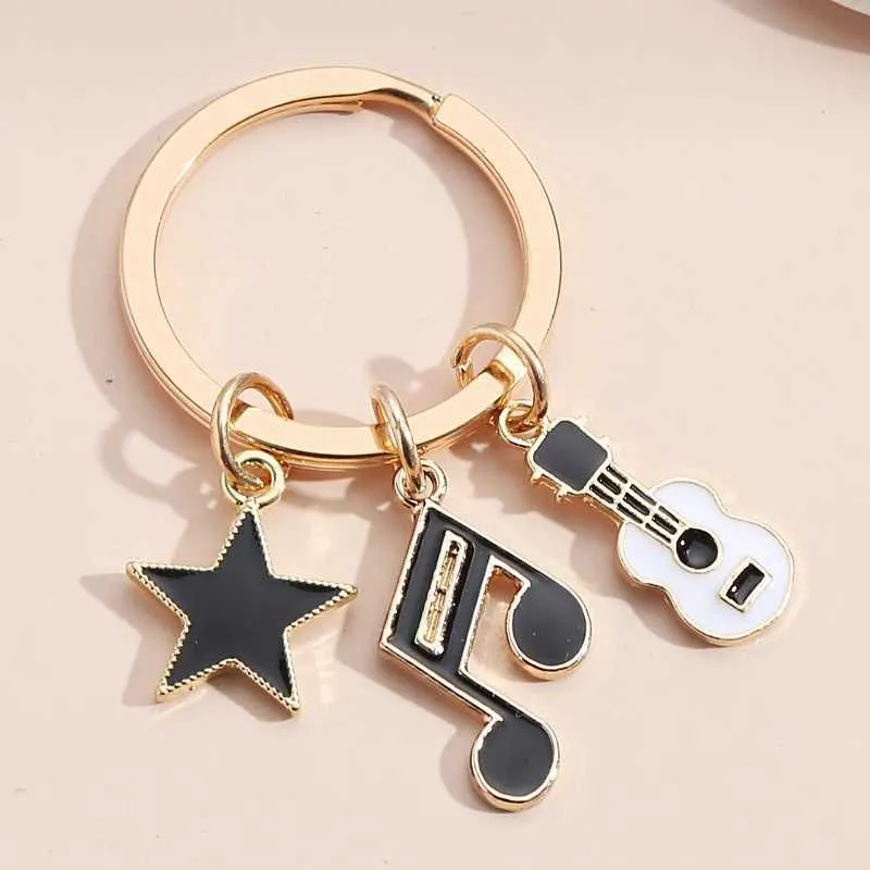 Keychains Lanyards Music Music Keychain Microphone Clavier Guitare Headset Star Joue Anneau chanteuse Chains pour femmes Men Diy Gift à la main bijoux fait à la main Q240403