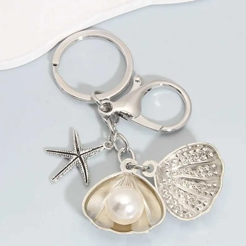 Keychains Lanyards Fashion Pearl Starfish Shell Alloy Keychain Silver Color Sea Key Chains för att göra handgjorda DIY -smycken Tillbehör Fynd Q240403