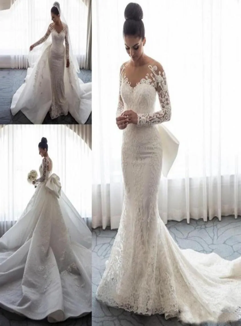 2019 Designer Long Sleeves Mermaid Wedding Dresses Sheer Neck Illusion Lace Applique Bow Overskirts Button Back Chapel Train Brida6290161